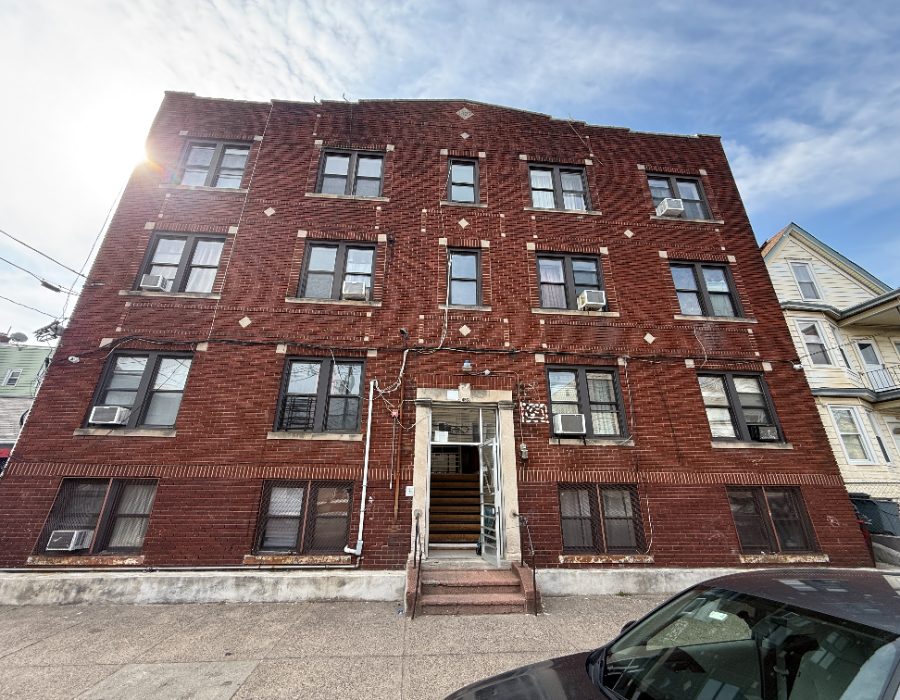 Brick apartment building inspected after storm damage
